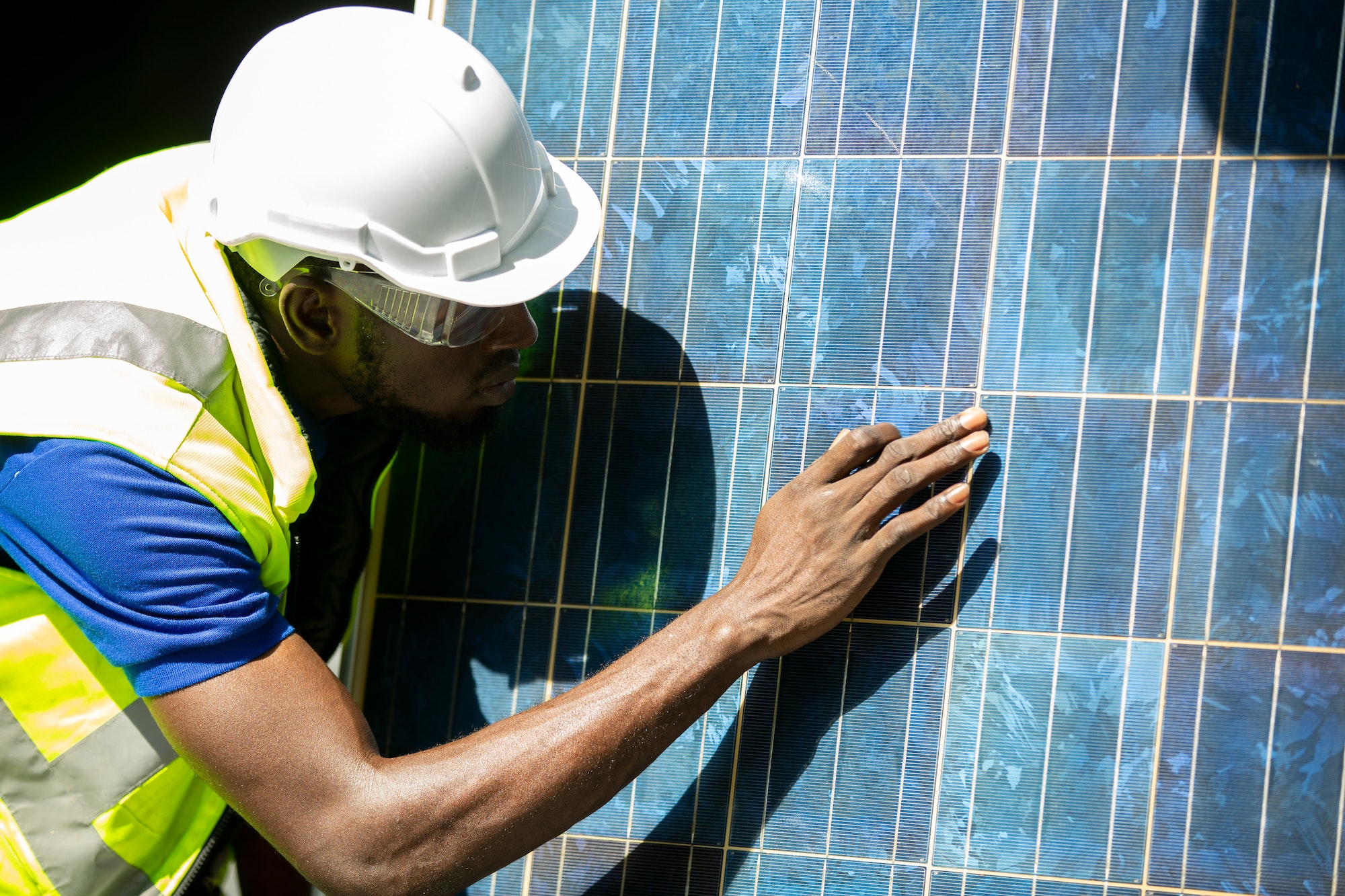african-american-worker-working-on-solar-cell-installation-at-sit-.jpg